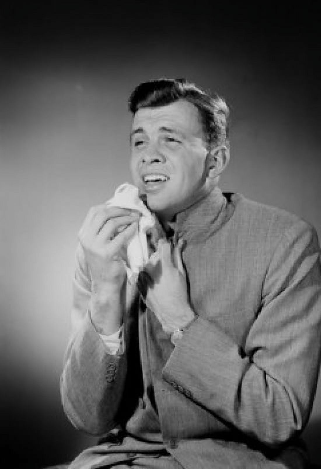 Man holding tissue and grimacing Canvas Art - (24 x 36)