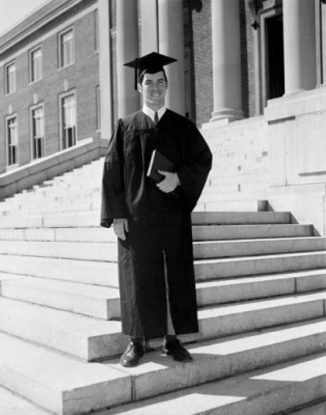 Man in graduation gown holding diploma Canvas Art - (24 x 36)