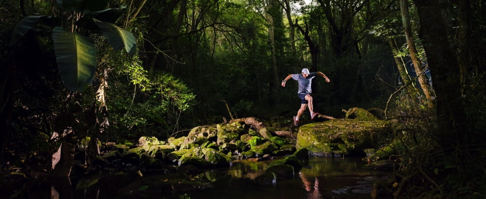 Man jumping across a river Kloof Kwazulu-Natal South Africa Canvas Art - Panoramic Images (27 x 9)