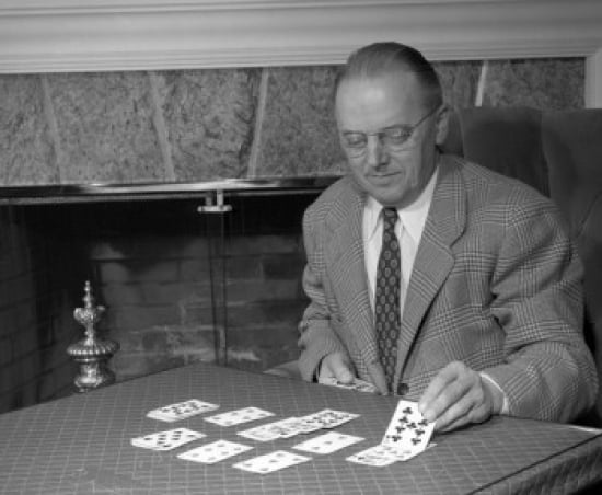 Man laying cards on table Canvas Art - (24 x 36)