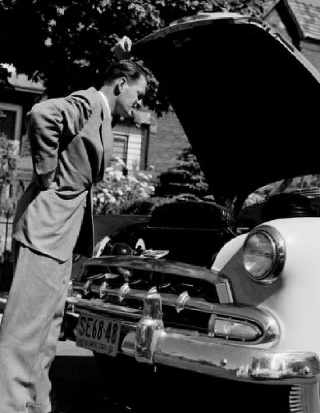 Man looking into car hood Canvas Art - (18 x 24)