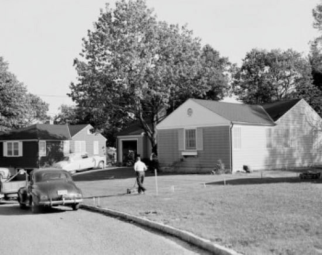 Man mowing lawn on suburbs Canvas Art - (18 x 24)