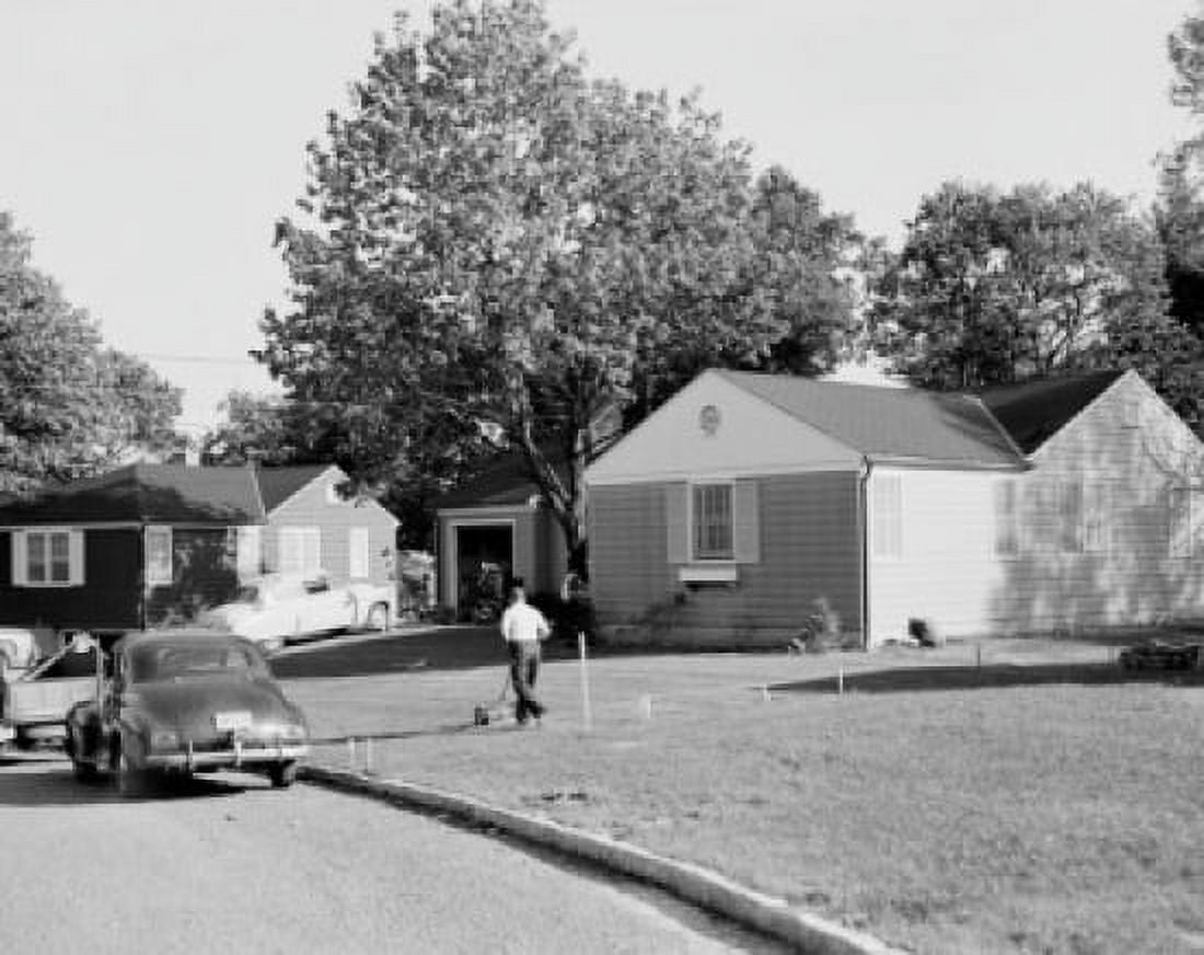 Man mowing lawn on suburbs Canvas Art -  (24 x 36)