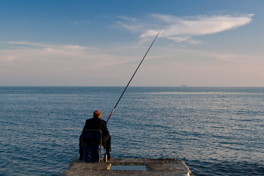 Man pier fishing Lighthouse Beach Sochi Black Sea Coast Krasnodar Krai Russia Canvas Art - Panoramic Images (27 x 9)