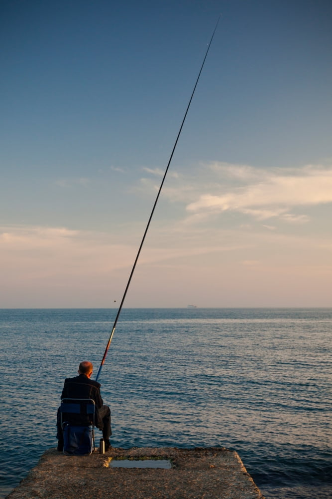 Man pier fishing Lighthouse Beach Sochi Black Sea Coast Krasnodar Krai Russia Canvas Art - Panoramic Images (27 x 9)