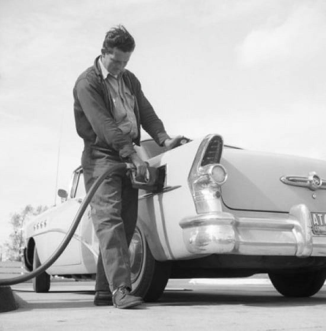 Man pouring petrol on gas station Canvas Art - (18 x 24)