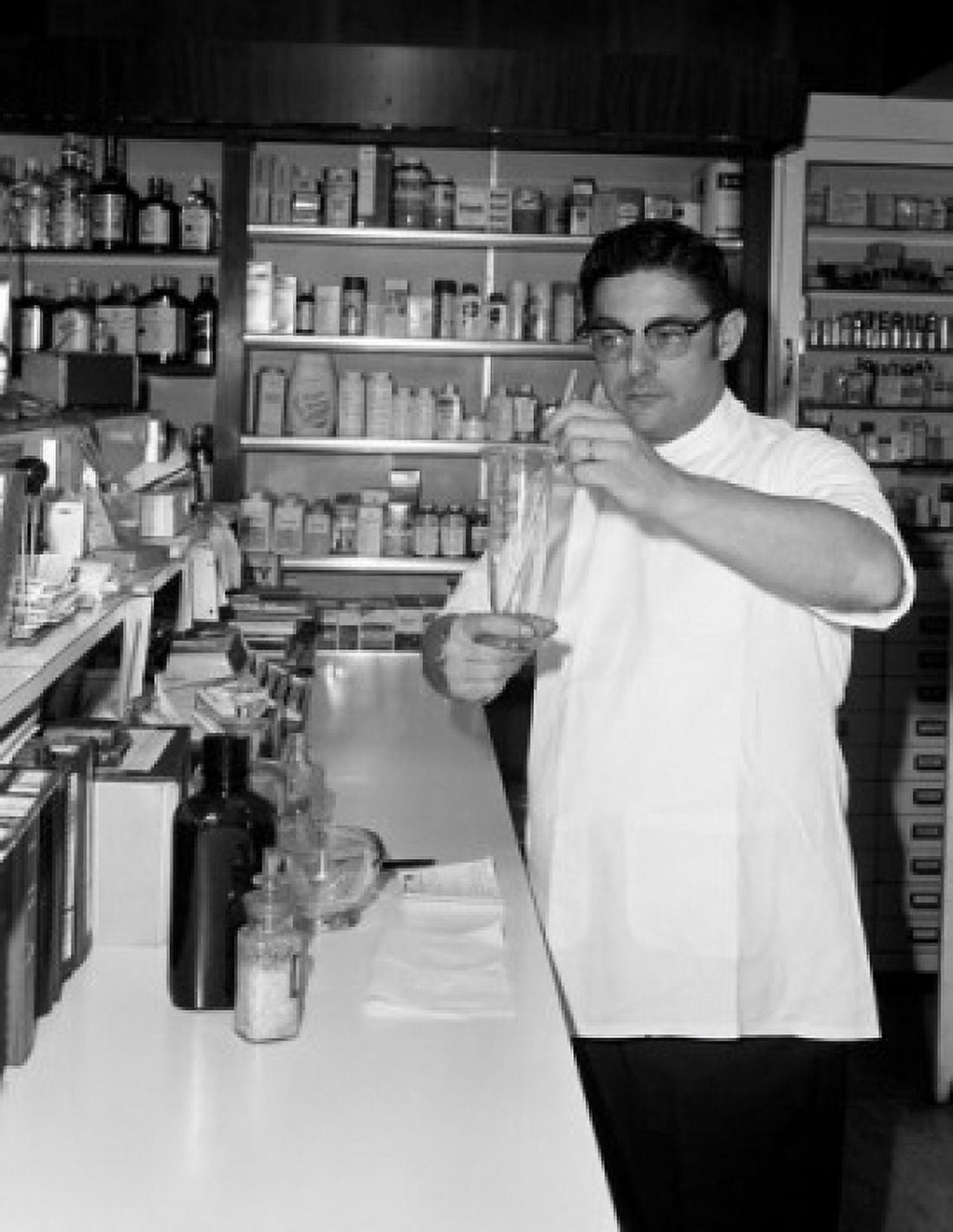 Man preparing medicines in pharmacy Canvas Art - (24 x 36)