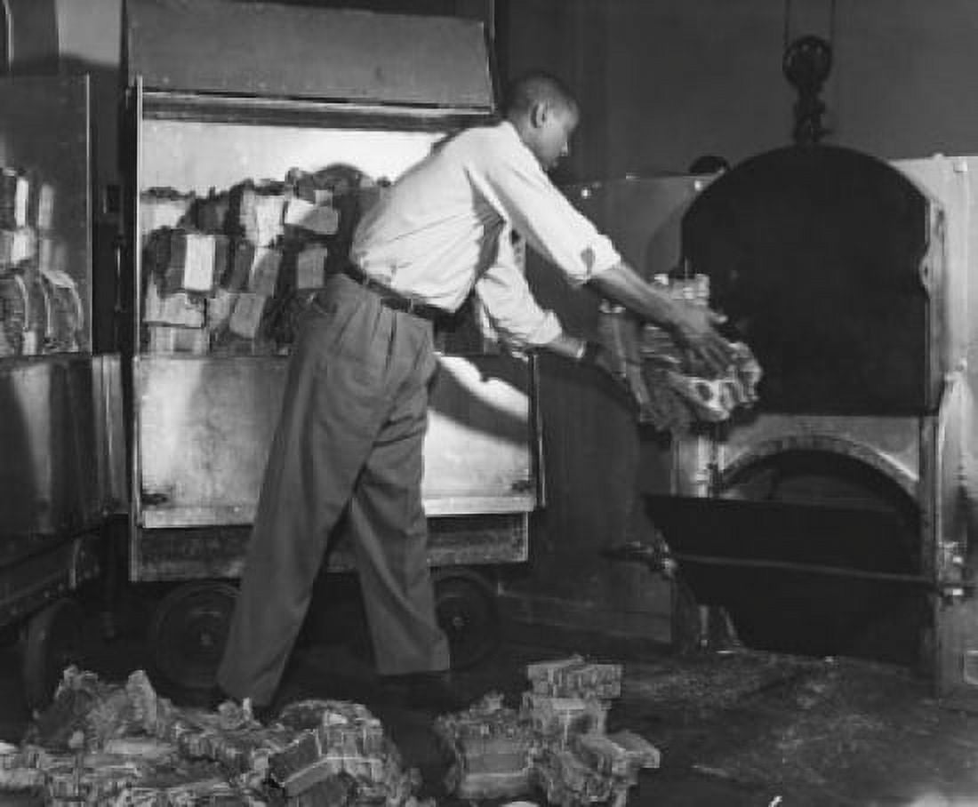 Man putting currency notes into a incinerator Canvas Art - (24 x 36)