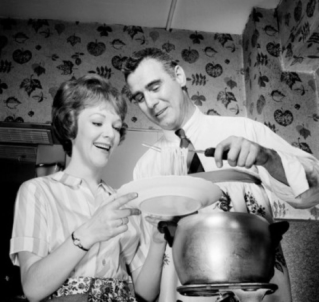 Man putting spaghetti on womans plate low angle view Canvas Art - (24 x 36)