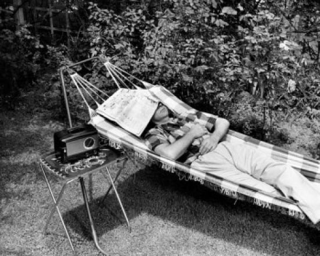 Man relaxing in hammock listening to radio Canvas Art - (24 x 36)