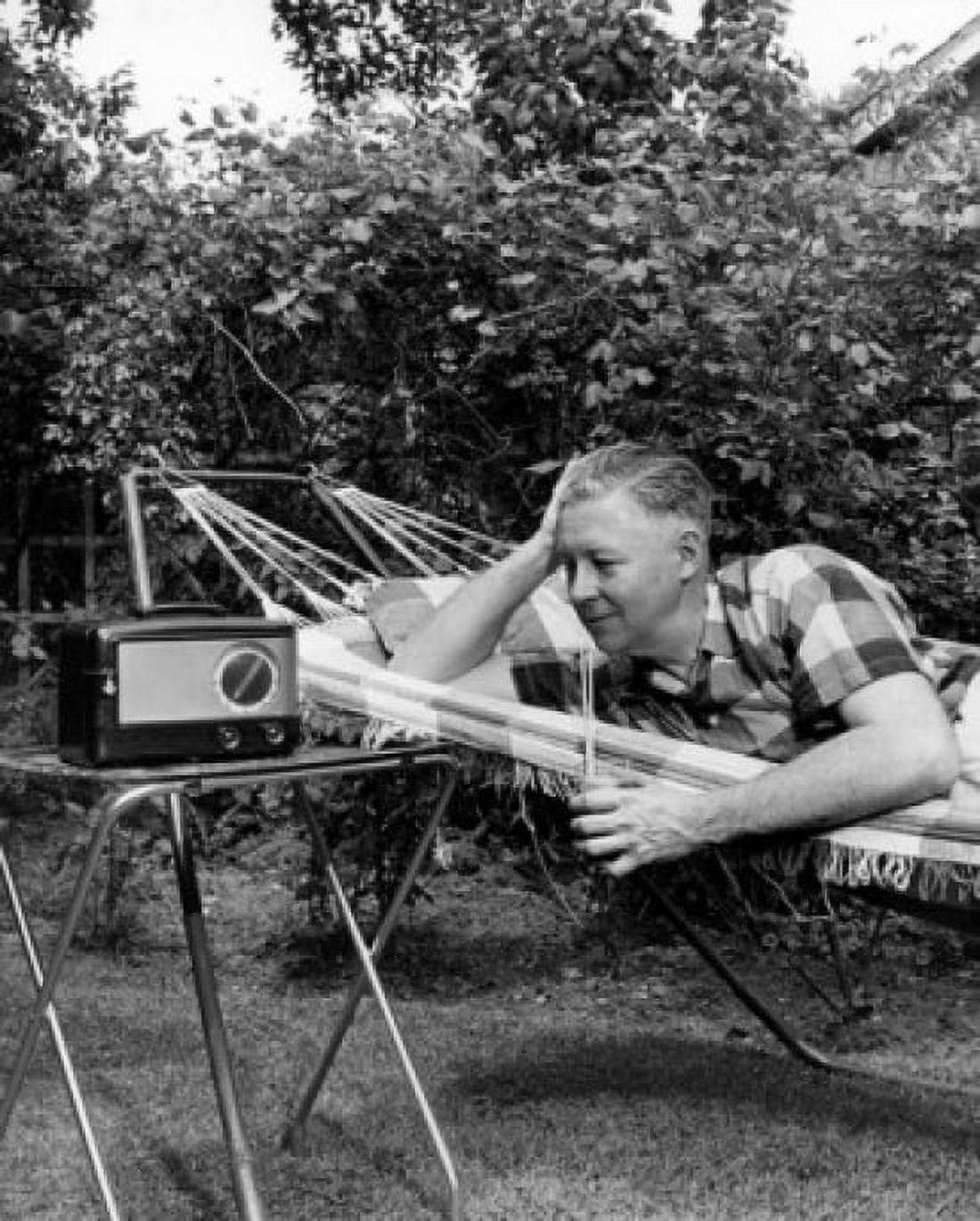 Man relaxing in hammock listening to radio Canvas Art - (24 x 36)