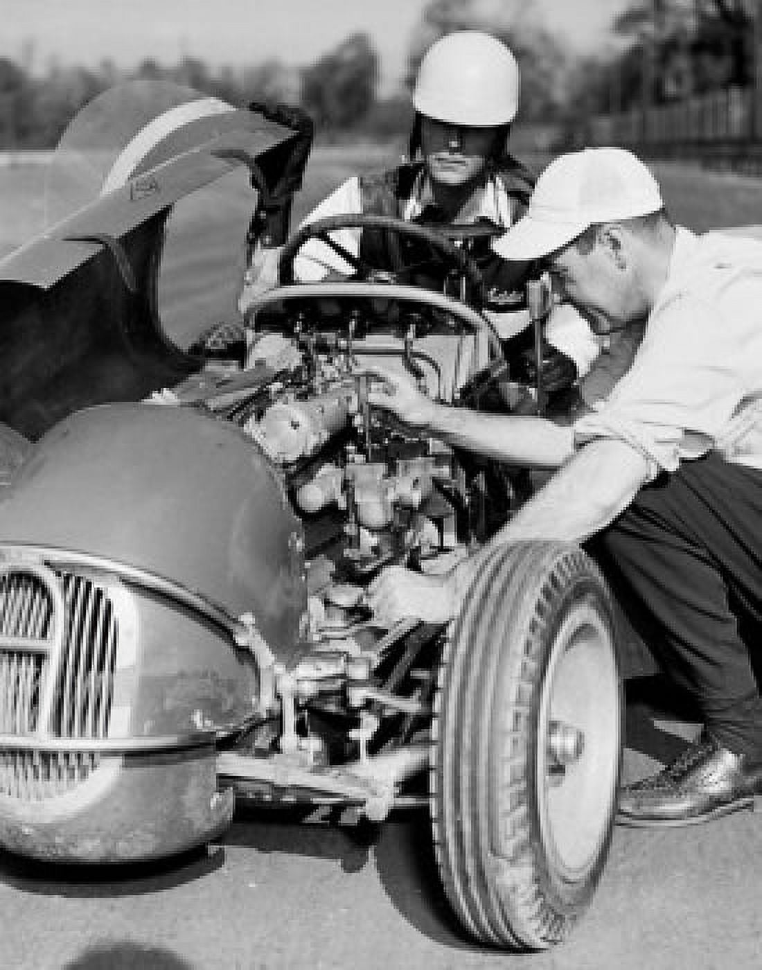 Man repairing racing car Canvas Art - (24 x 36)