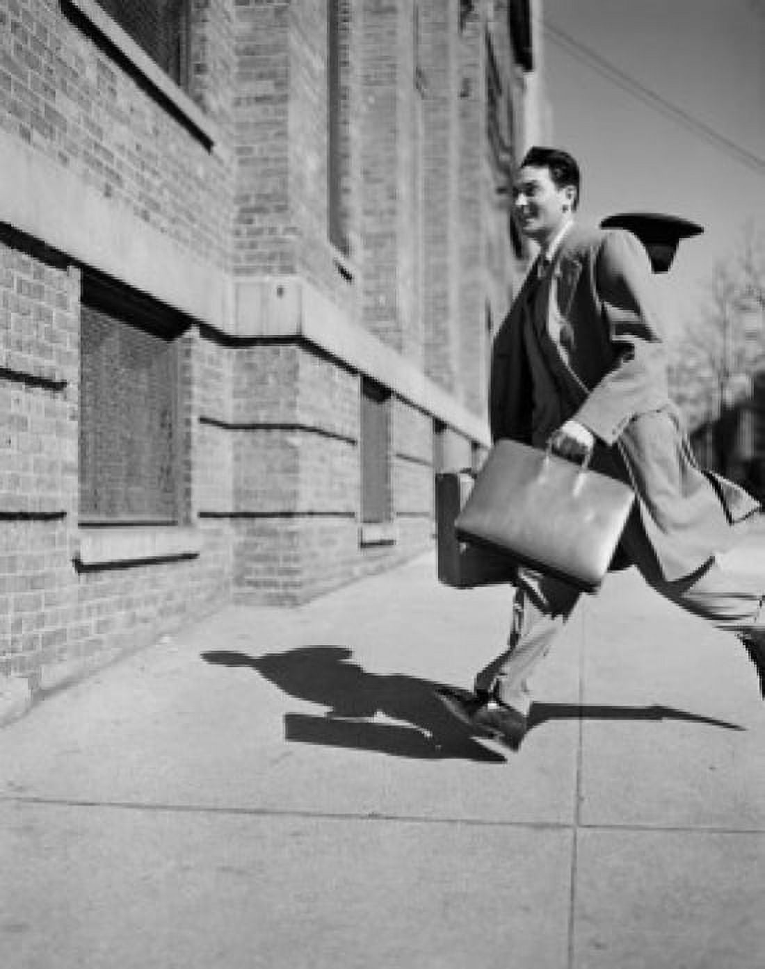 Man running hat blowing off Canvas Art - (24 x 36)
