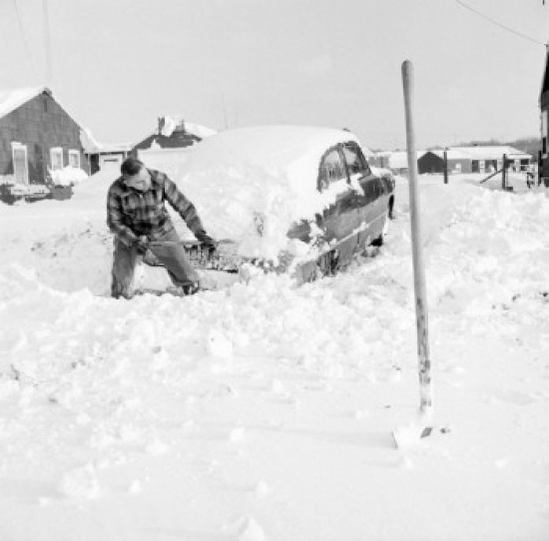 Man shoveling snow from car Canvas Art - (24 x 36)