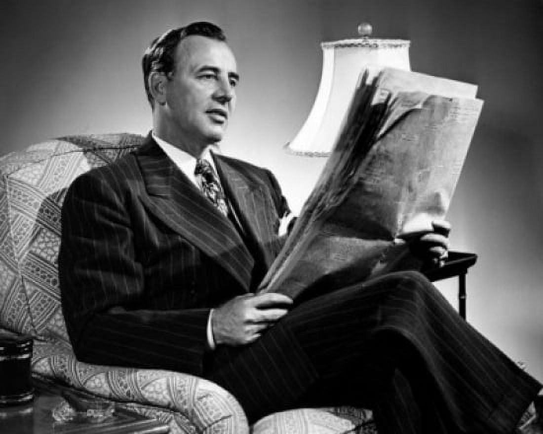 Man sitting in armchair reading newspaper Canvas Art - (18 x 24)