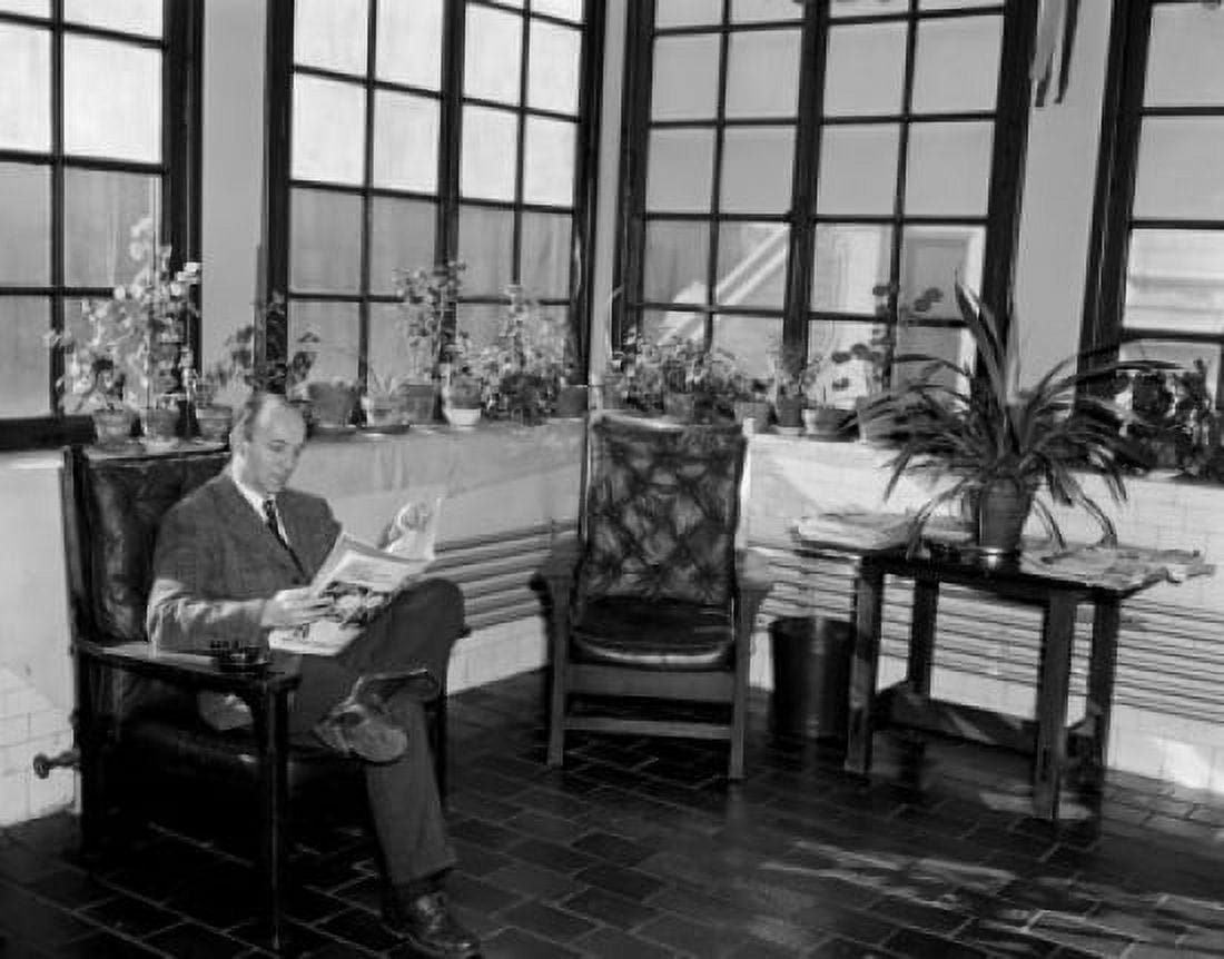 Man sitting in room reading newspaper Canvas Art - (18 x 24)