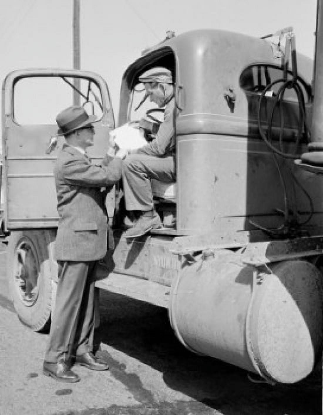 Man sitting in truck and talking with man in suit Canvas Art - (24 x 36)