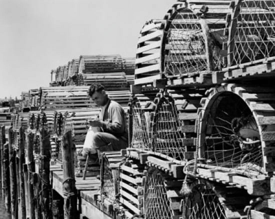 Man sitting on a dock with lobster traps around him McKinley Maine USA Canvas Art -  (18 x 24)
