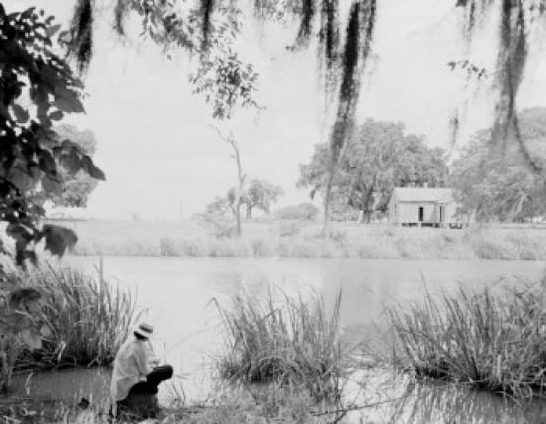 Man sitting on riverbank Canvas Art - (18 x 24)