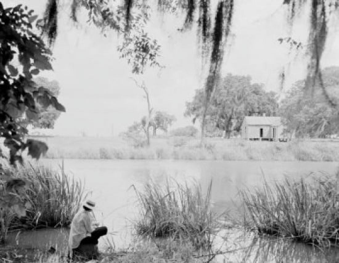 Man sitting on riverbank Canvas Art - (24 x 36)