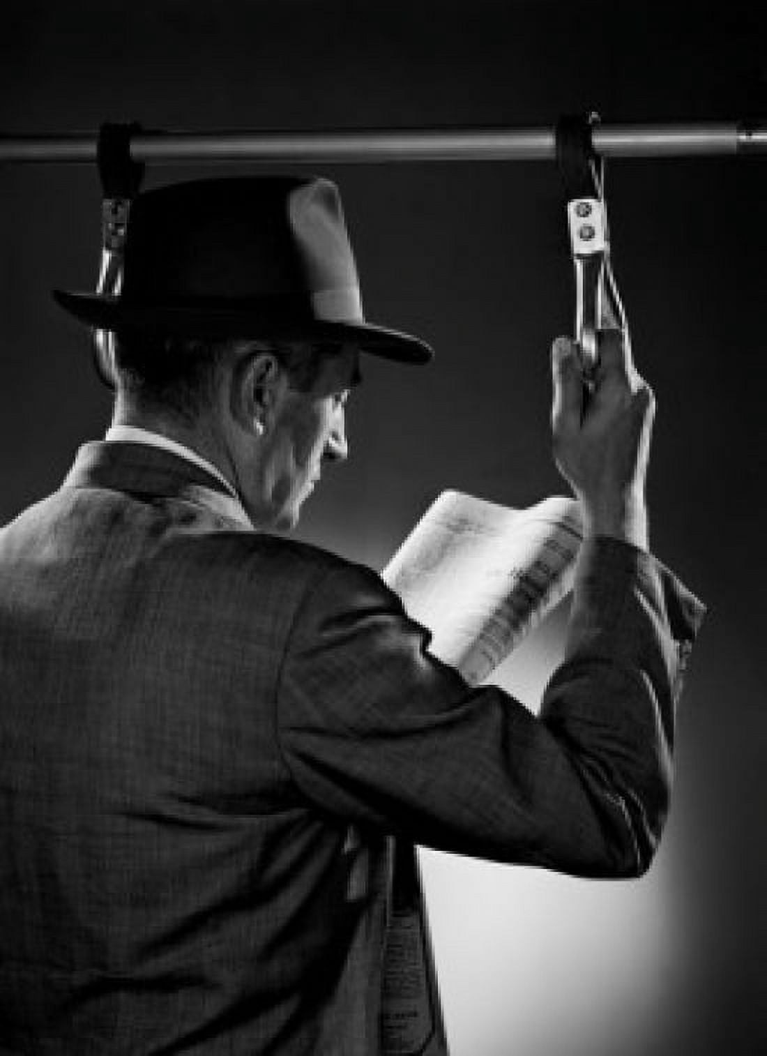 Man standing and reading newspaper studio shot Canvas Art - (18 x 24)