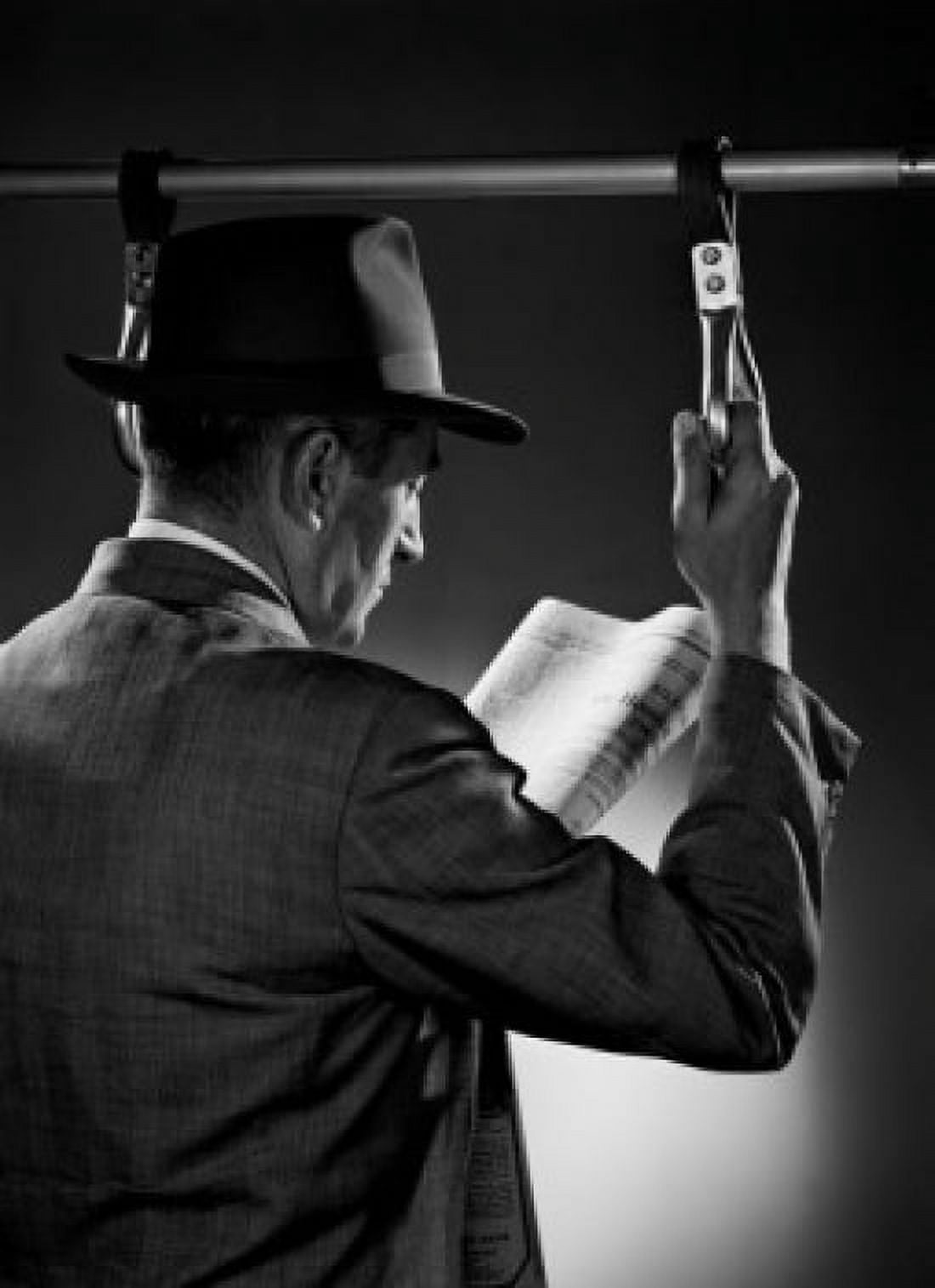 Man standing and reading newspaper studio shot Canvas Art - (24 x 36)