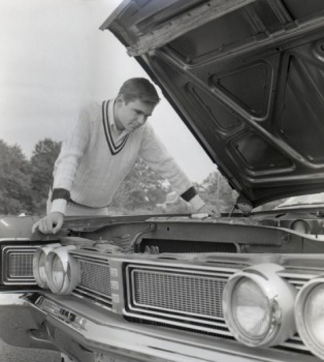 Man standing at open car hood Canvas Art - (24 x 36)