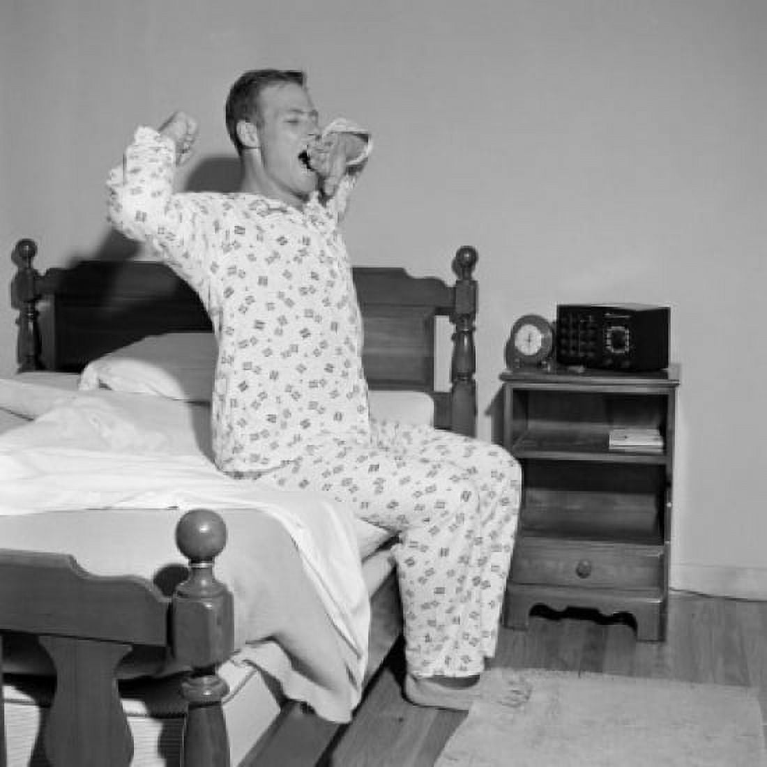 Man stretching on bed Canvas Art - (18 x 24)