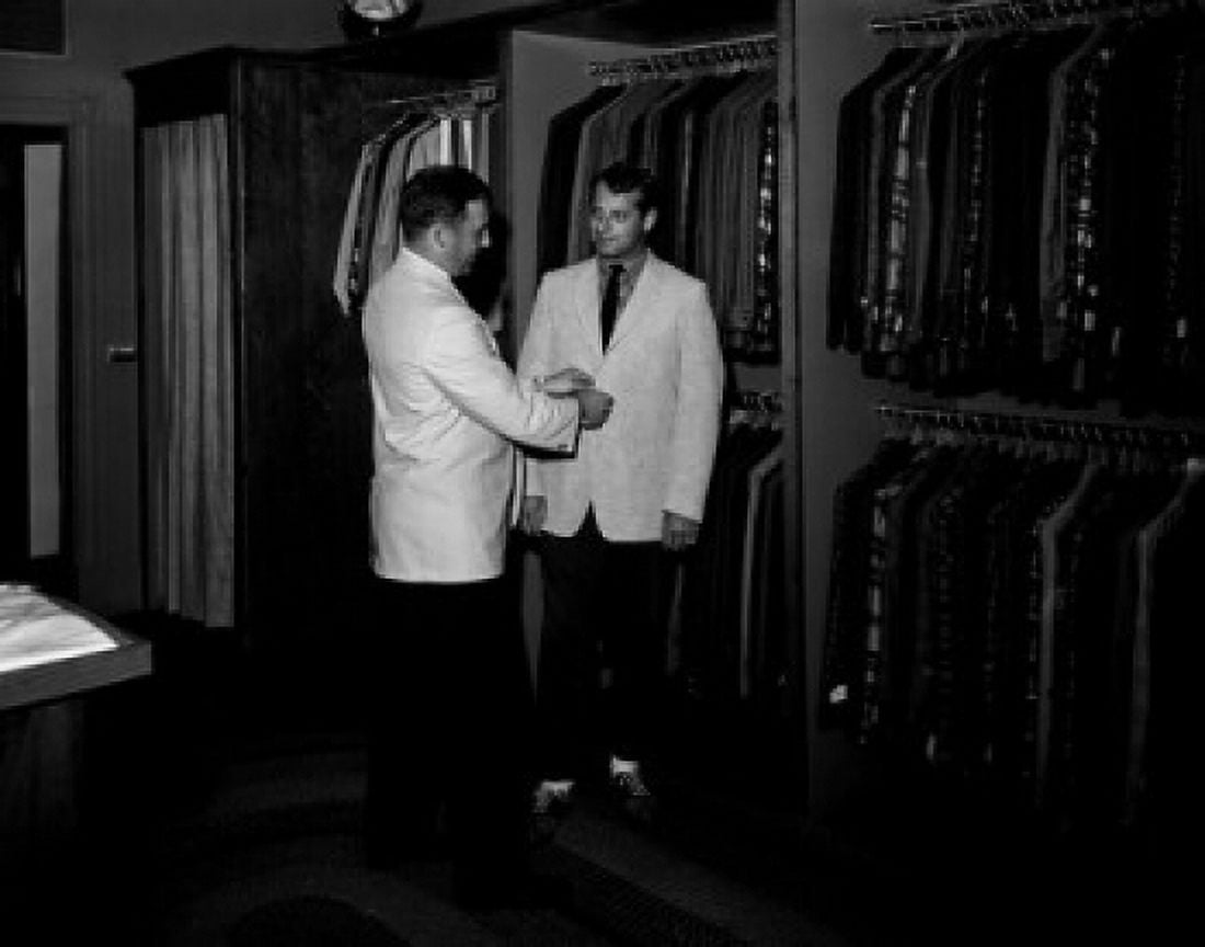 Man trying on new suit Canvas Art - (24 x 36)