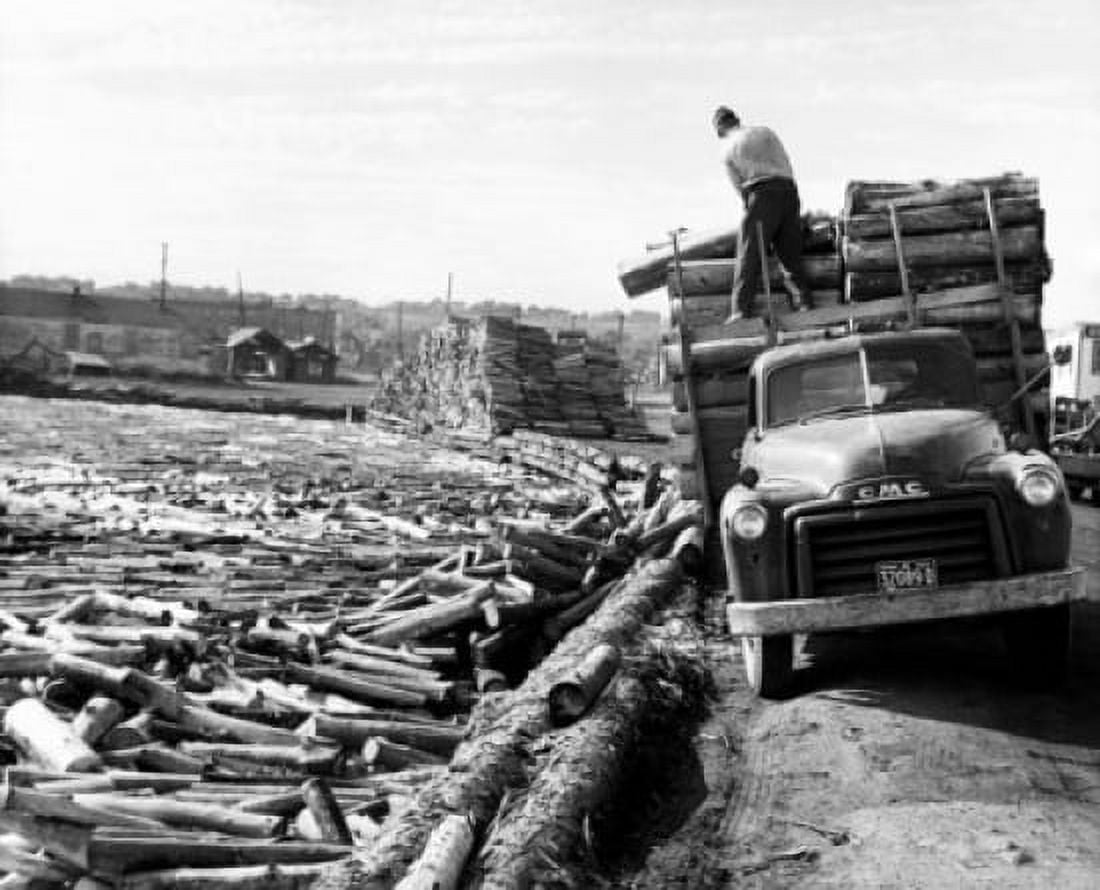 Man unloading logs from a truck Port Arthur Ontario Canada Canvas Art - (18 x 24)