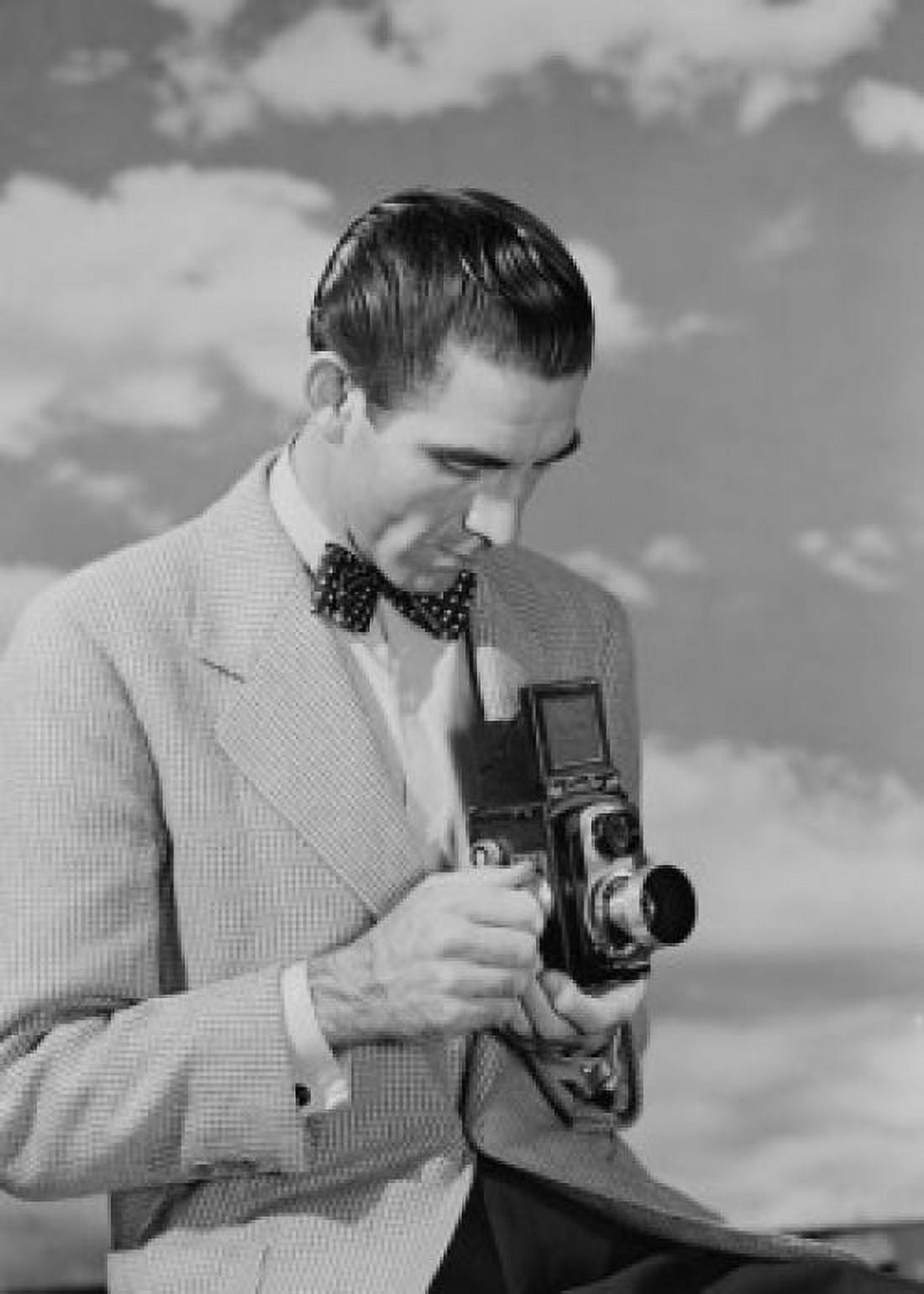 Man using camera Canvas Art - (18 x 24)