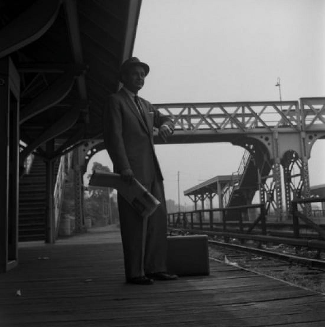 Man waiting at railroad station and checking time Canvas Art - (18 x 24)