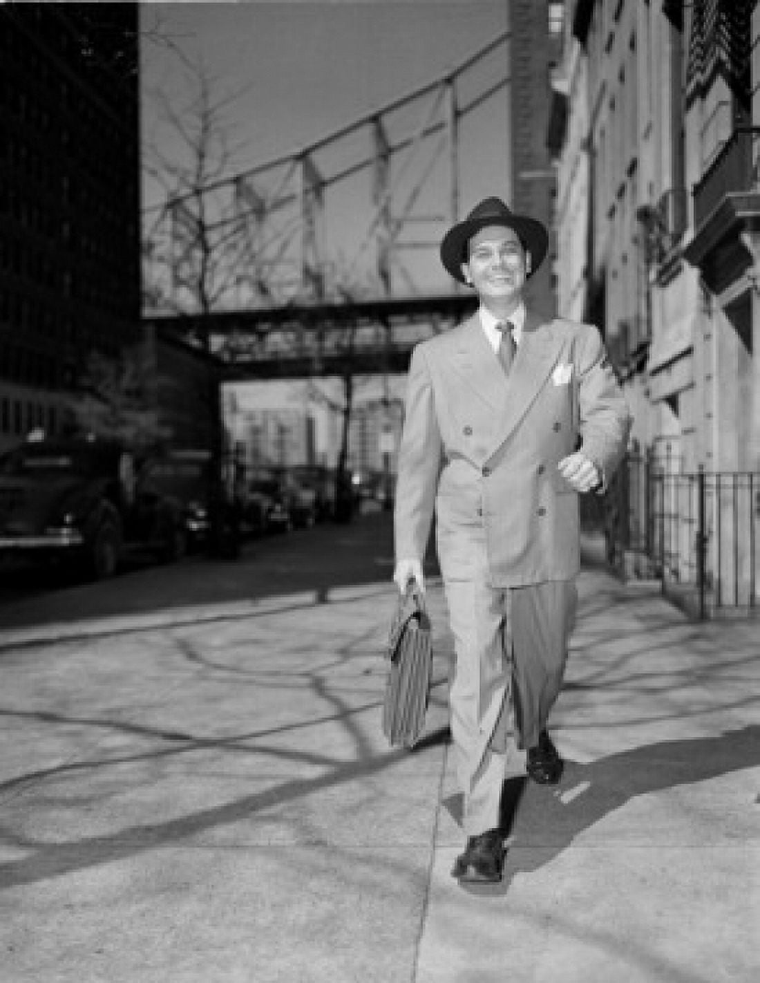 Man with briefcase walking down street Canvas Art - (18 x 24)