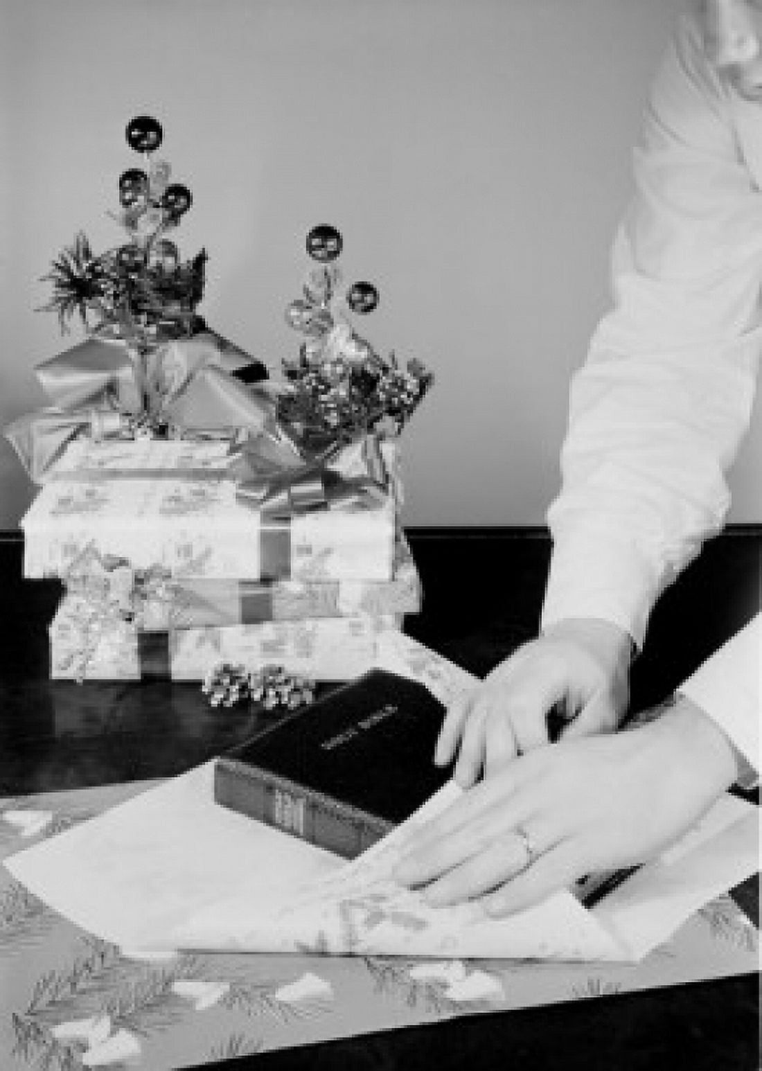 Man wrapping bible as Christmas gift Canvas Art - (18 x 24)