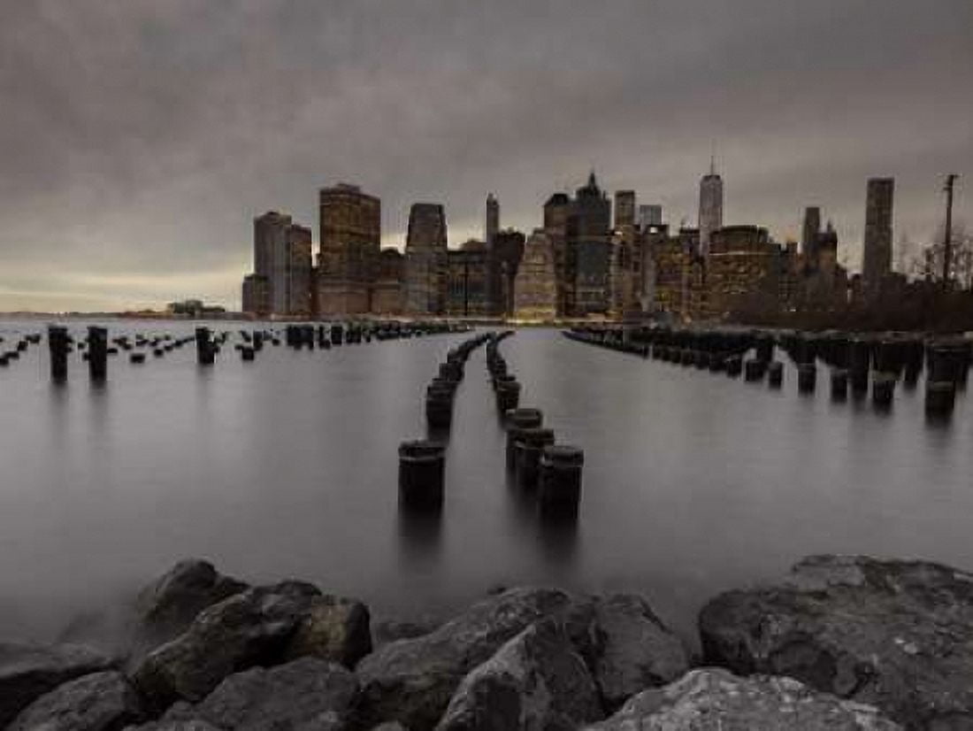 Manhattan skyline with rows of groynes in East river New York Canvas Art - Assaf Frank (18 x 24)