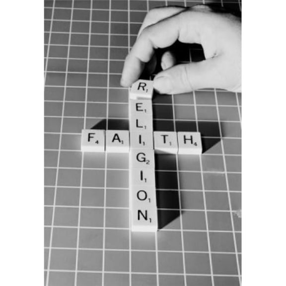 Mans Hand Making Religious Cross From Scrabble Pieces Poster Print 18 x 24 in.