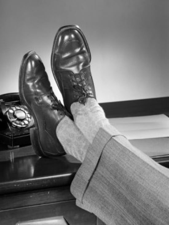 Mans feet on desk Canvas Art - (18 x 24)