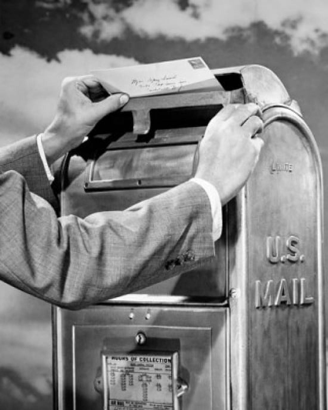 Mans hand dropping mail into a mailbox Canvas Art - (18 x 24)