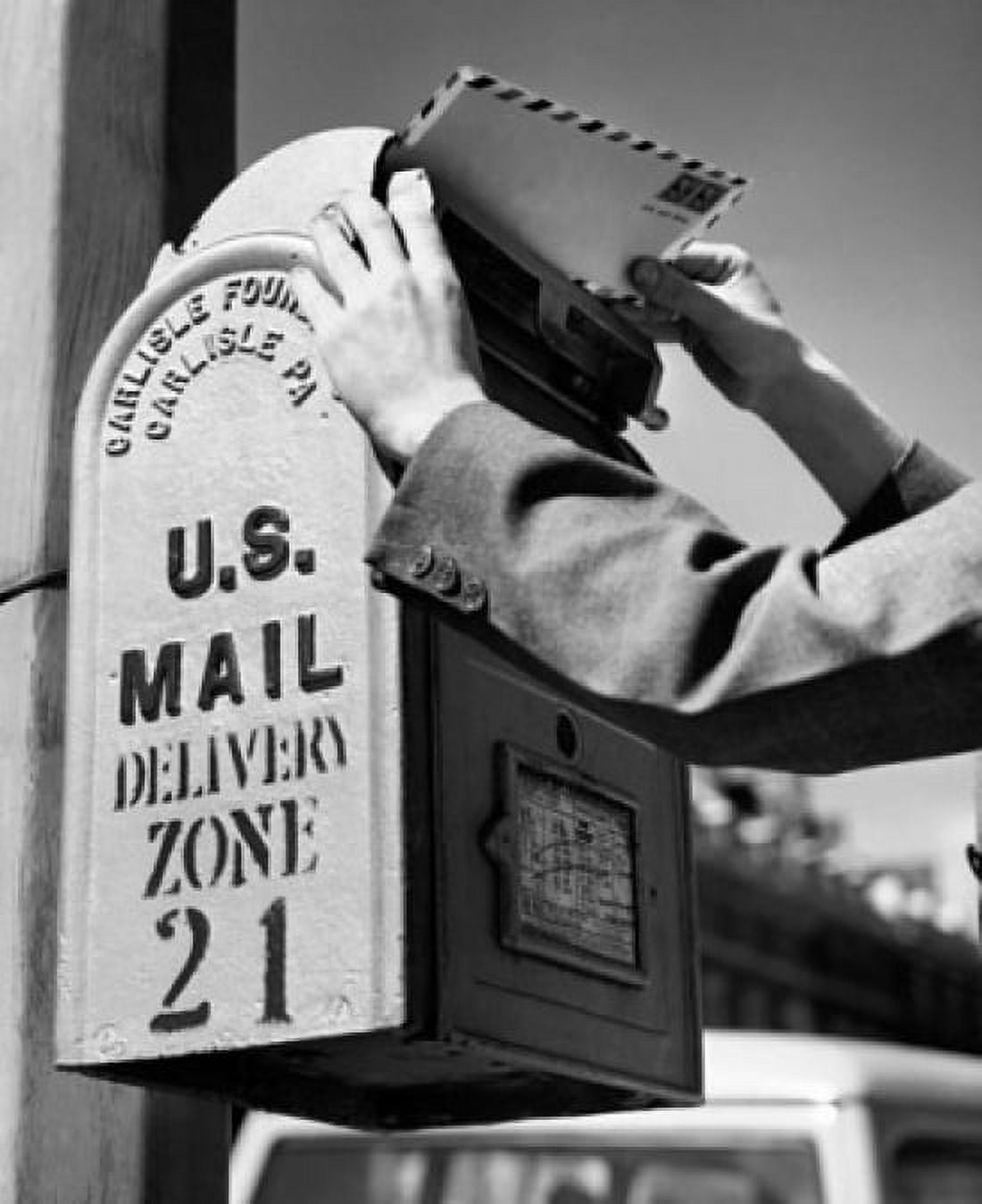 Mans hand dropping mail into a mailbox Canvas Art - (24 x 36)