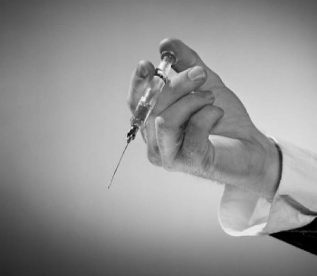 Mans hand holding syringe Canvas Art - (24 x 36)
