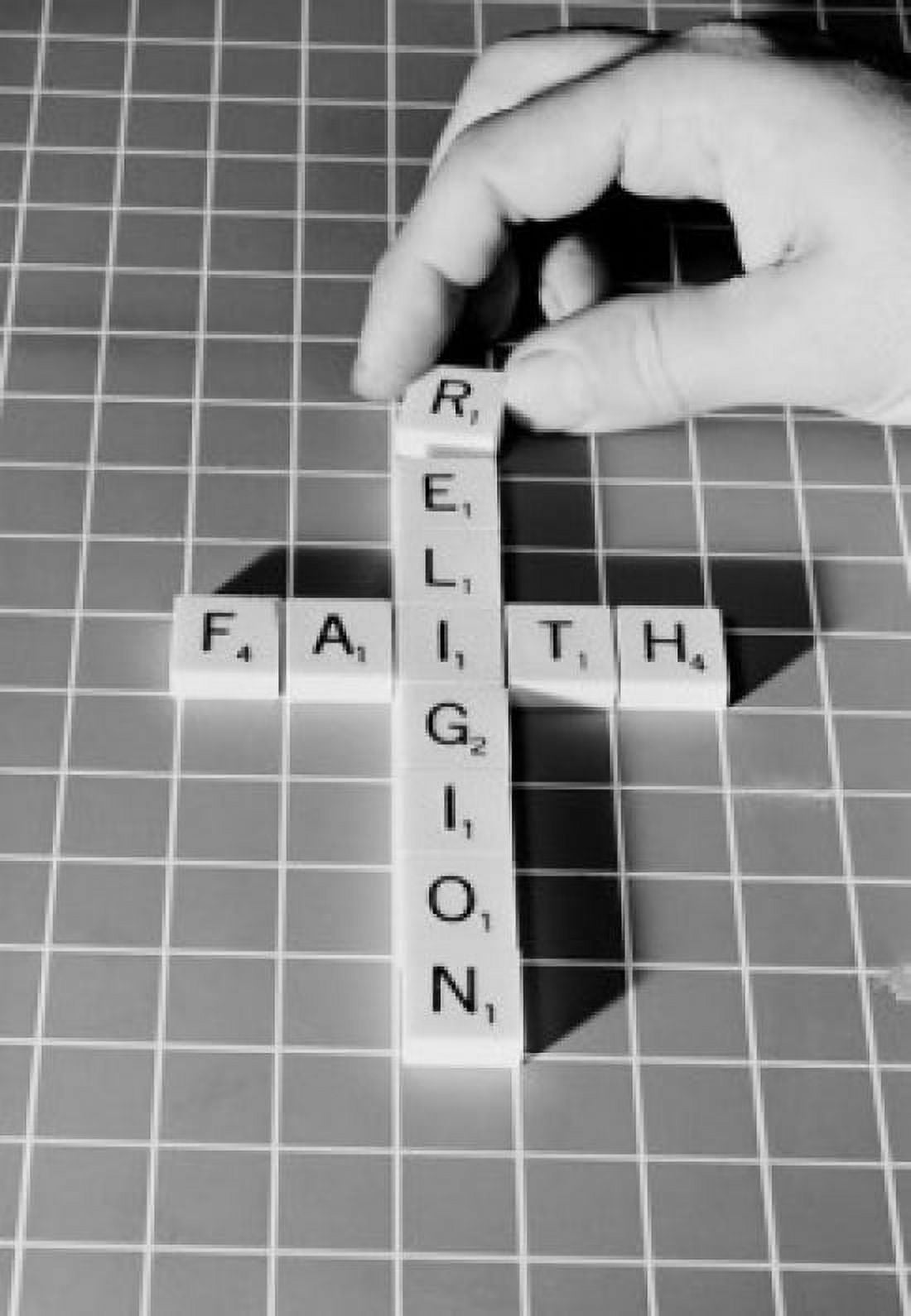 Mans hand making religious cross from scrabble pieces Canvas Art - (18 x 24)