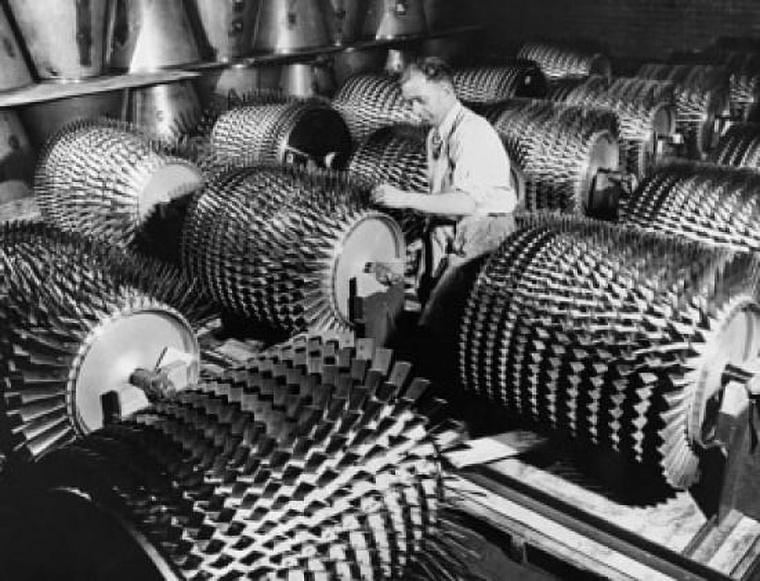 Manual worker working on compressor rotors in a jet engine factory Canvas Art - (18 x 24)