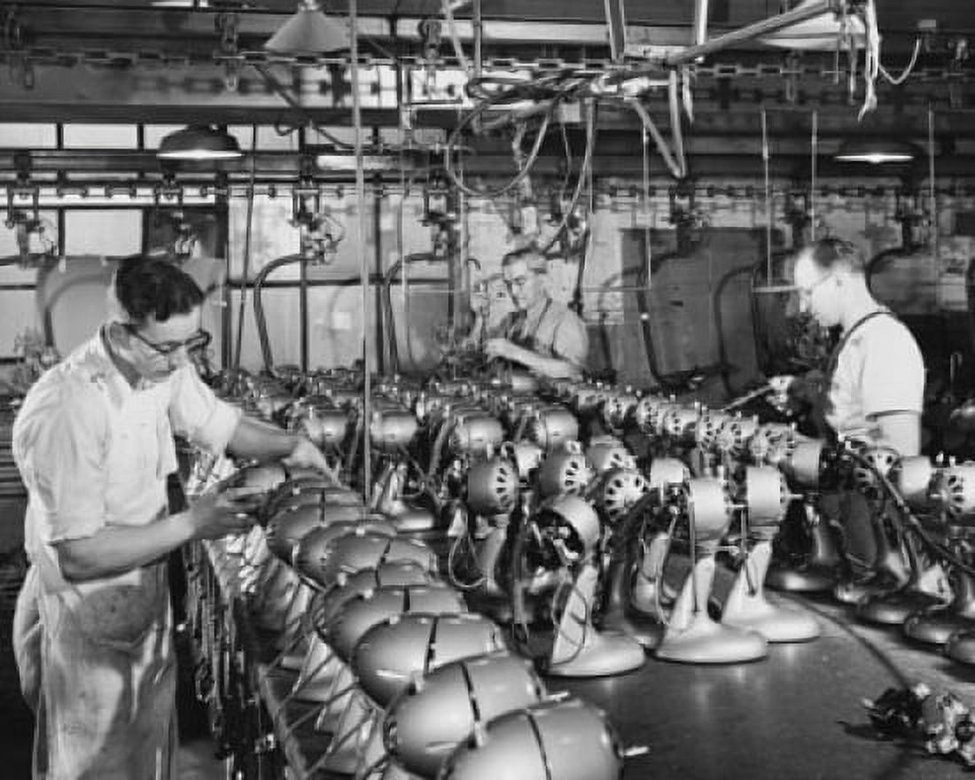 Manual workers assembling electric fans at a factory Canvas Art - (18 x 24)