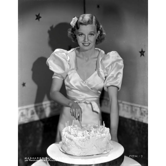 Margaret Sullivan smiling in White Blouse while Slicing Cake Photo Print (8 x 10)