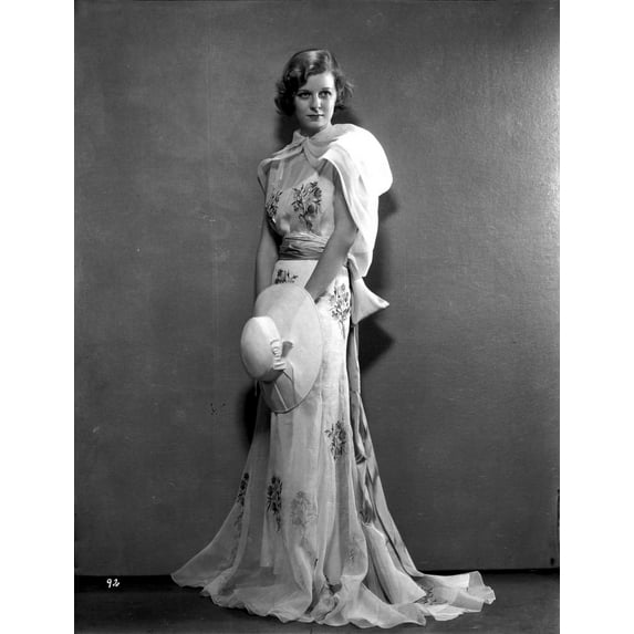 Margaret Sullivan standing in White Gown with Hat Photo Print (24 x 30)