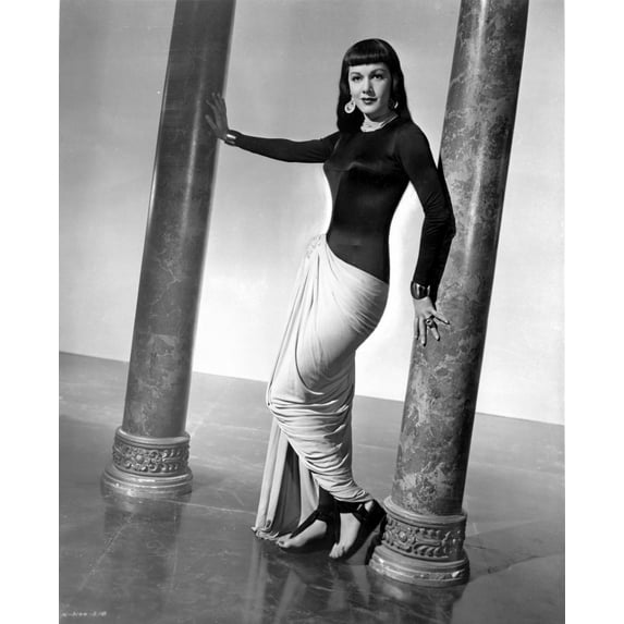 Maria Montez standing in Black and White Dress with Heels Photo Print (8 x 10)