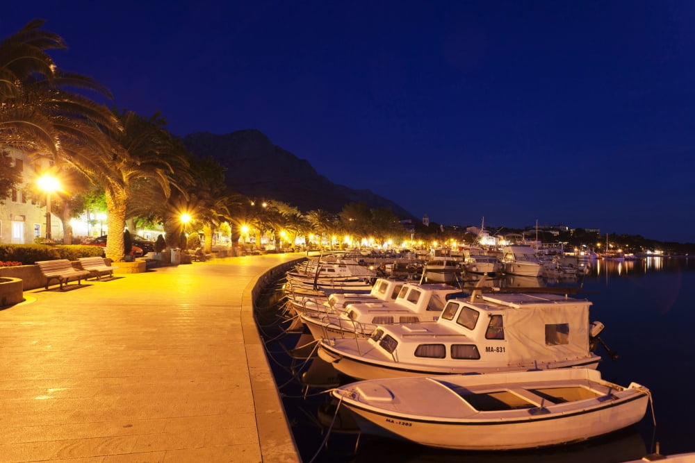 Marina and promenade at night Baska Voda Biokovo Split-Dalmatia County Croatia Canvas Art - Panoramic Images (27 x 9)