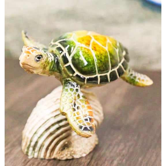 Marine Green Sea Turtle Swimming Over Partridge Tun Shell Spring Bobble Figurine