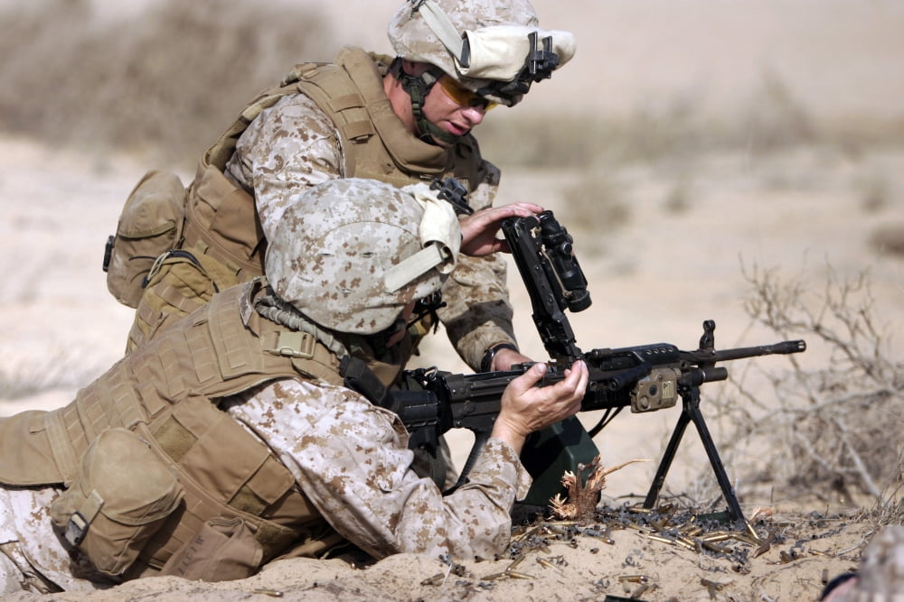 Marine gives instructions on how to perform remedial action on the squad automatic weapon Canvas Art - Stocktrek Images (34 x 23)