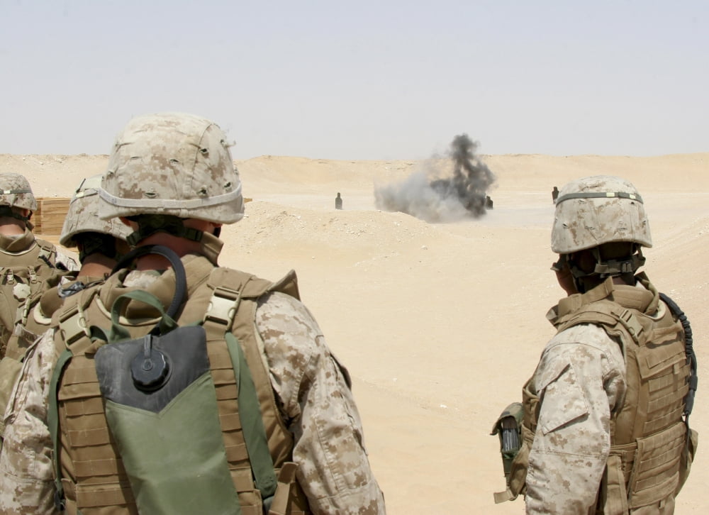 Marines and sailors look on as an explosion goes off Canvas Art - Stocktrek Images (33 x 24)